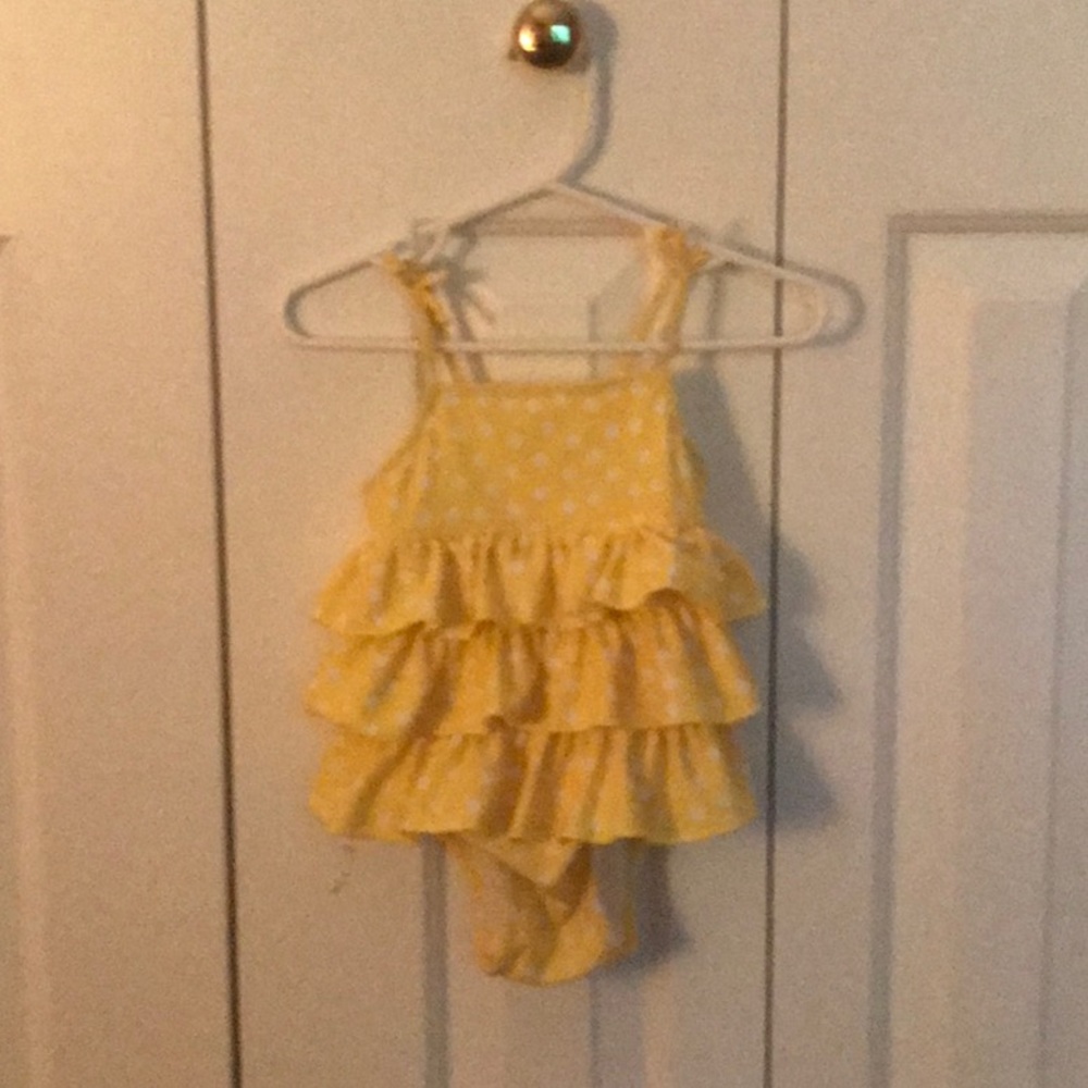 White and yellow poka dot swim suit